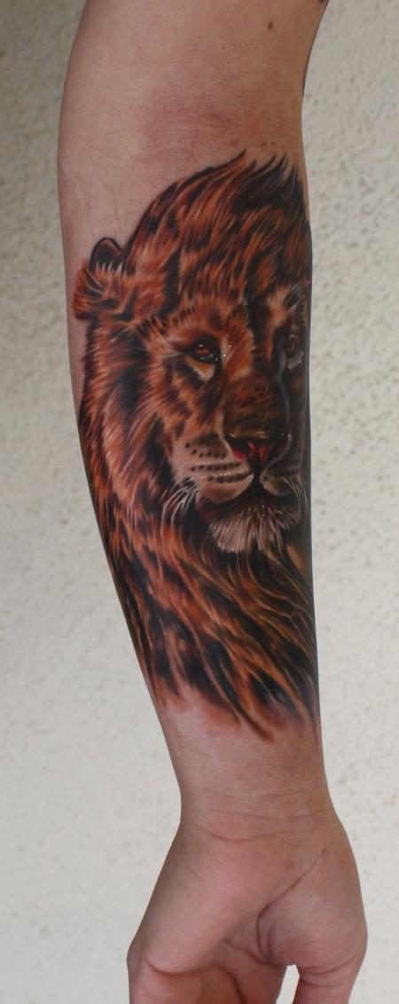 Ty McEwen - lion tattoo